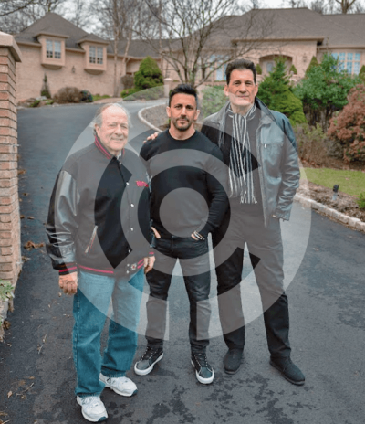 Robert Funaro, Jason Cerbone and Dan Grimaldi standing in front of Sopranos house